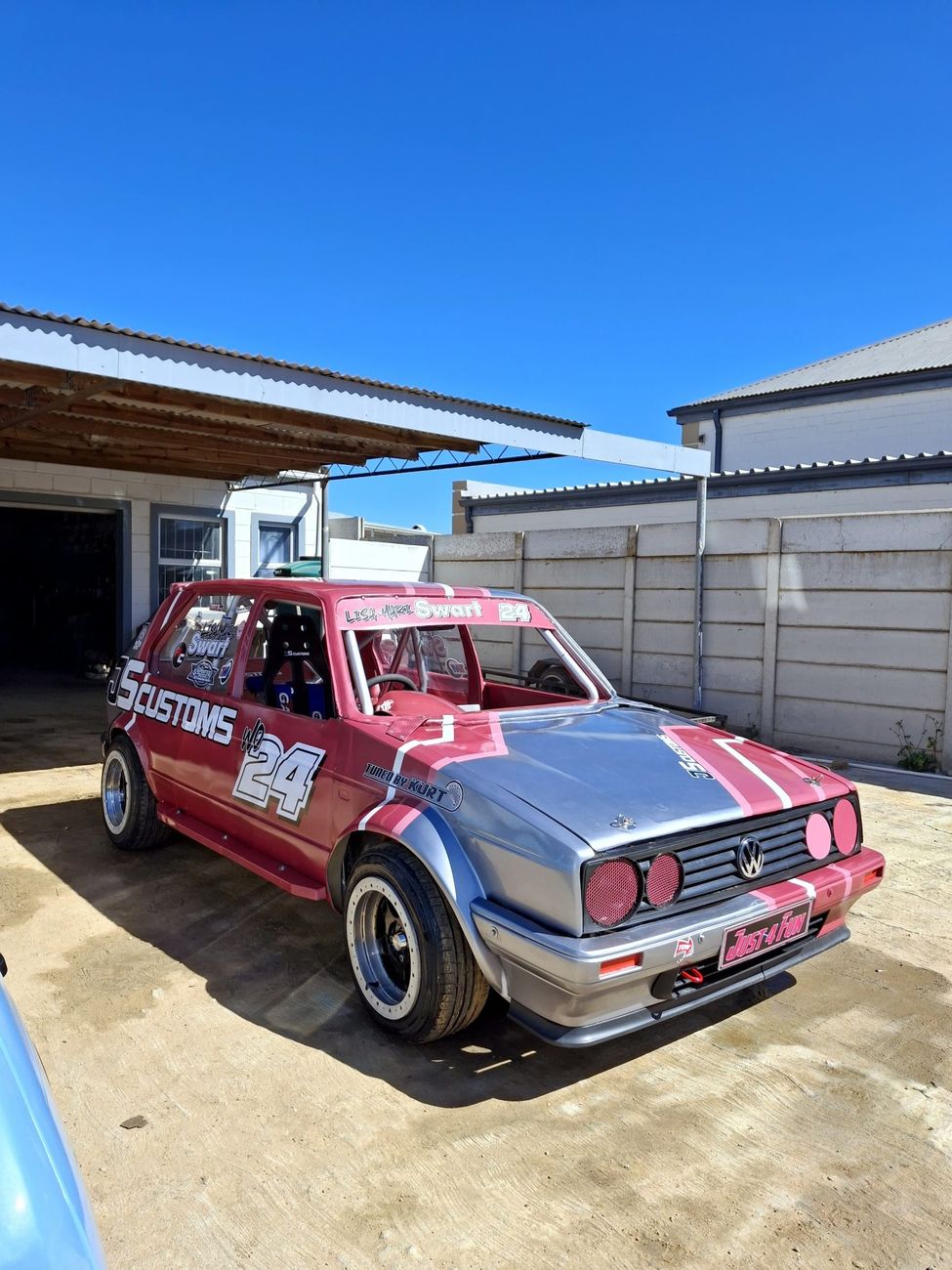 Golf stock car after respray in pink and silver with number 24
